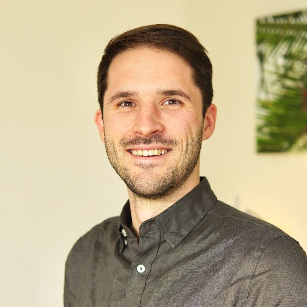 Aaron Bertoia smiling at the camera.